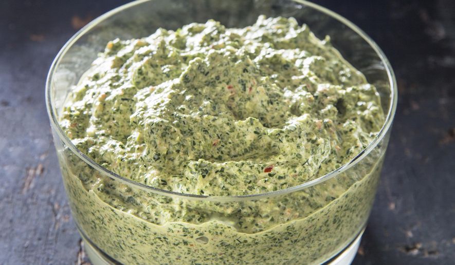 This undated photo provided by America's Test Kitchen in October 2018 shows Herbed Spinach Dip in Brookline, Mass. This recipe appears in the cookbook "All-Time Best Appetizers." (Joe Keller/America's Test Kitchen via AP)