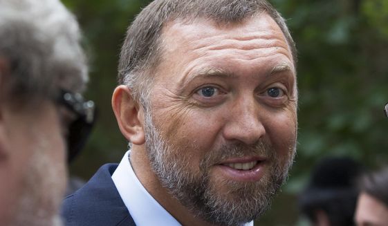 FILE - In this July 2, 2015 file photo, Russian metals magnate Oleg Deripaska attends Independence Day celebrations at Spaso House, the residence of the American Ambassador, in Moscow, Russia. A day after the World Economic Forum said it will include a Russian delegation at the forum, Kremlin spokesman Dmitry Peskov on Monday Dec. 17, 2018, welcomed the announcement that billionaires Oleg Deripaska and Viktor Vekselberg, and the head of the state-controlled bank VTB Andrei Kostin, will be able to attend the annual gathering in the Swiss ski resort of Davos in January. (AP Photo/Alexander Zemlianichenko, File)