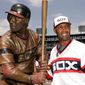Chicago White Sox first base coach Harold Baines poses with his life-sized sculpture during a ceremony before their baseball game against the Kansas City Royals, Sunday, July 20, 2008, in Chicago.(AP Photo/Nam Y. Huh)