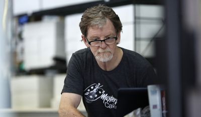 In this Monday, June 4, 2018, photograph, baker Jack Phillips, owner of Masterpiece Cakeshop, manages his shop after the U.S. Supreme Court ruled that he could refuse to make a wedding cake for a same-sex couple because of his religious beliefs did not violate Colorado&#x27;s anti-discrimination law in Lakewood, Colo. (AP Photo/David Zalubowski) **FILE**