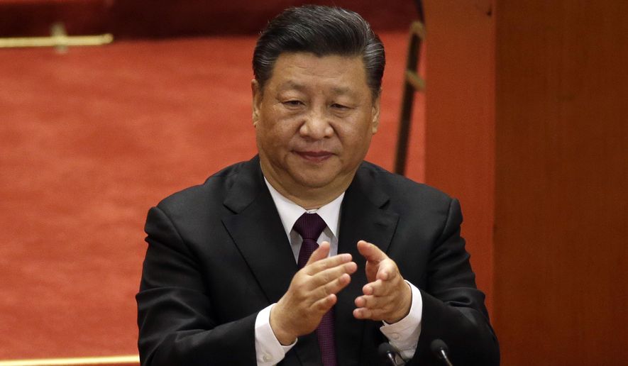 Chinese President Xi Jinping applauds during a conference to commemorate the 40th anniversary of China&#x27;s Reform and Opening Up policy at the Great Hall of the People in Beijing, Tuesday, Dec. 18, 2018. (AP Photo/Mark Schiefelbein)