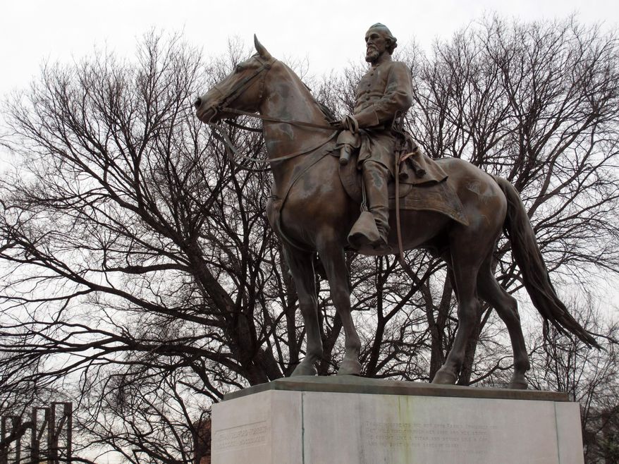 FILE - In this Feb. 6, 2013, file photo, a statue of Nathan Bedford Forrest sits on a concrete pedestal at a park named after the confederate cavalryman in Memphis Tenn. Descendants of Nathan Bedford Forrest are claiming that the graves of the Confederate general and his wife were desecrated when the statue of him was removed from a Tennessee park last year. Forrest’s great-great-grandsons filed a lawsuit in a Memphis court Monday, Dec. 17, 2018, seeking damages and possession of the statue after it was taken down in December 2017. (AP Photo/Adrian Sainz, File)