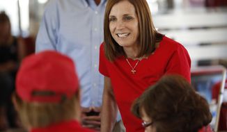FILE - In this Nov. 6, 2018, file photo, Arizona Republican senatorial candidate Martha McSally, speaks with voters, at Chase&#39;s diner in Chandler, Ariz. Arizona&#39;s governor has named McSally to replace U.S. Sen. Jon Kyl in the U.S. Senate seat that belonged to Sen. John McCain. Republican Gov. Doug Ducey announced Tuesday, Dec. 18, that McSally will take over after Kyl&#39;s resignation becomes effective Dec. 31. McSally lost the Senate race to Democratic Rep. Kyrsten Sinema. (AP Photo/Matt York, File)