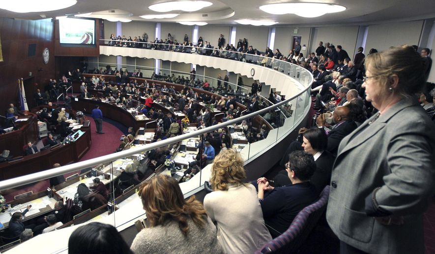 In this Feb 6, 2017, file photo, spectators look watch the Nevada State Assembly on the opening day of the Legislative Session in Carson City, Nev. Nevada became the first state in the U.S. with an overall female-majority in the Legislature on Tuesday, Dec. 18, 2018, when county officials in Las Vegas appointed two women to fill vacancies in the state Assembly. (AP Photo/Lance Iversen, File)