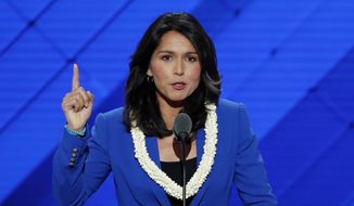 In this July 26, 2016, file photo, Rep. Tulsi Gabbard, D-HI., nominates Sen. Bernie Sanders, I-VT., for president of the United States during the second day of the Democratic National Convention in Philadelphia. (AP Photo/J. Scott Applewhite, File)