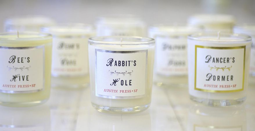 This photo provided by Kimberly Austin shows some of the San Francisco-based designer's scented candles. Austin has given each of the scented candles she's created for her Austin Press studio a little back story and interesting name. "I wanted them to be like vintage apothecary jars with samples of places and people," says Austin. (Kimberly Austin/Austin Press via AP)