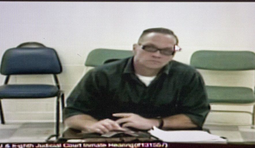 FILE - In this Dec. 5, 2017, file photo, Nevada death row inmate Scott Dozier appears for his court hearing via video at the Regional Justice Center in Las Vegas. Nevada prison officials say death row inmate Dozier has gone to great lengths to try to kill himself while awaiting execution, including attempting to obtain a fatal drop of a deadly drug on a piece of paper sent through prison mail. (Erik Verduzco/Las Vegas Review-Journal via AP)