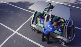 This undated image provided by The Kroger Co. shows an autonomous vehicle called the R1. Nuro and grocery chain Kroger are teaming up to bring unmanned delivery service to customers. The companies said Tuesday, Dec. 18, 2018, that Nuro&#39;s unmanned vehicle, the R1, will be added to a fleet of autonomous Prius vehicles that have run self-driving grocery delivery service in Scottsdale, Ariz., with vehicle operators since August. (The Kroger Co. via AP)