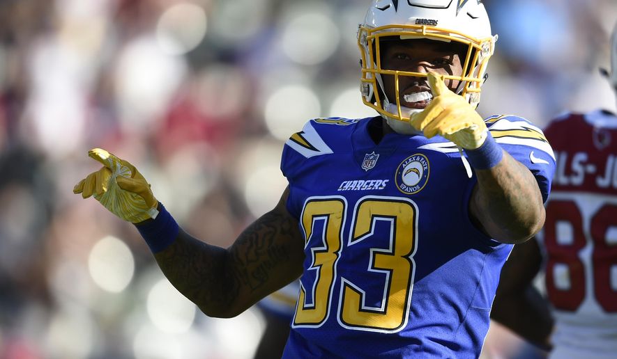 FILE - In this Nov. 25, 2018 file photo Los Angeles Chargers free safety Derwin James (33) gestures after intercepting a pass from Arizona Cardinals quarterback Josh Rosen during the first half of an NFL football game in Carson, Calif. The Los Angeles Chargers placed seven players in the Pro Bowl, including safety Derwin James, one of six rookies across the league to make the game, which will be played Jan. 27 in Orlando. (AP Photo/Kelvin Kuo, file)