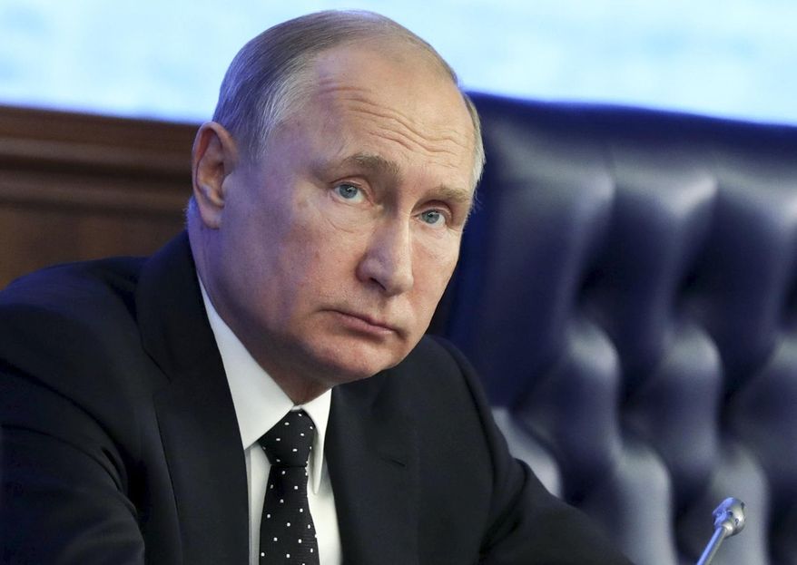 Russian President Vladimir Putin attends a meeting with the top military staff in the Russian Defense Ministry's headquarters in Moscow, Russia, Tuesday, Dec. 18, 2018. Putin said that new Russian weapons have no foreign equivalents, helping ensure the nation's security for decades to come. (Mikhail Klimentyev, Sputnik, Kremlin Pool Photo via AP)