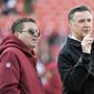 Washington Redskins owner Dan Snyder (left) and president Bruce Allen (right) talk on the field prior to an NFL football game between the Dallas Cowboys and Washington Redskins, Sunday, Oct. 21, 2018, in Landover, Md. (AP Photo/Mark Tenally) **FILE**

