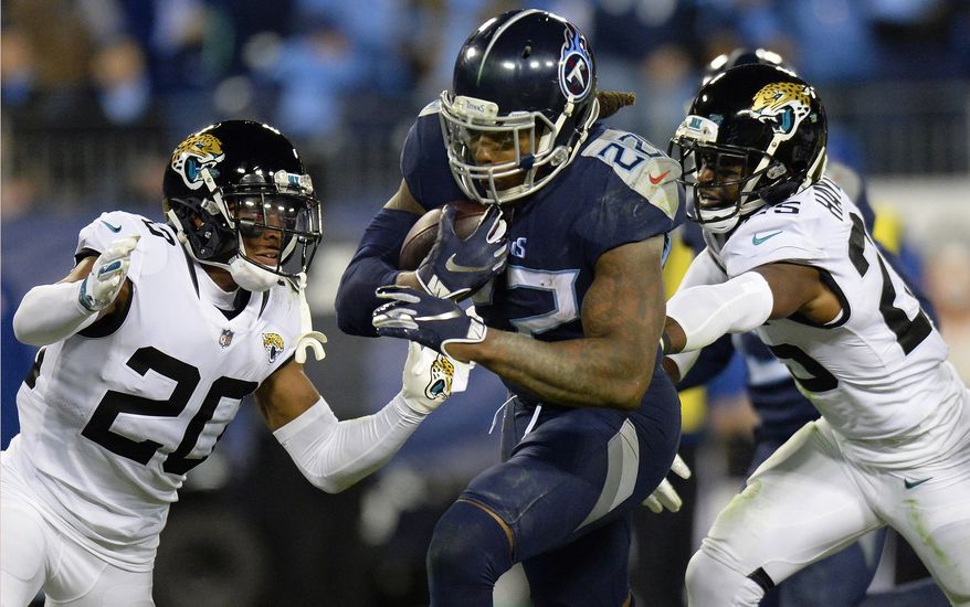 FILE - In this Thursday, Dec. 6, 2018, file photo, Tennessee Titans running back Derrick Henry (22) runs for a touchdown past Jacksonville Jaguars cornerback Jalen Ramsey (20) during the second half of an NFL football game in Nashville, Tenn. Unthinkable at the start of December, Henry has piled up a franchise-record 408 yards over his past two games to put the Titans running back 118 yards shy of his first 1,000-yard rushing season. (AP Photo/Mark Zaleski, File) **FILE**
