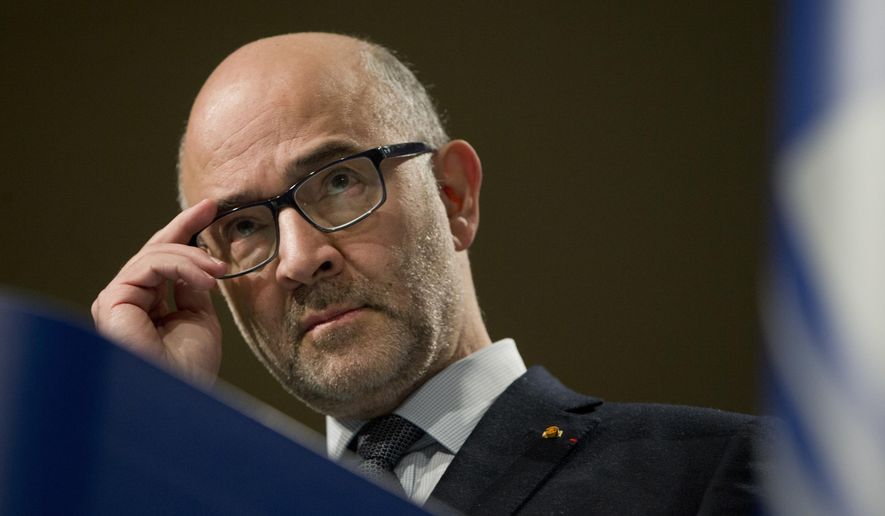 European Commissioner for Economic and Financial Affairs Pierre Moscovici pauses before speaking during a media conference at EU headquarters in Brussels, Wednesday, Dec. 19, 2018. The European Commission says it has reached an agreement with Italy to avert action over the country&#x27;s budget plans, which the EU&#x27;s executive arm had warned could break euro currency rules. (AP Photo/Virginia Mayo)