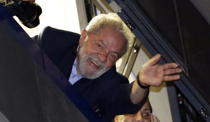 FILE - In this April 5, 2018 file photo, Brazil's former President Luiz Inacio Lula da Silva waves to supporters, in Sao Bernardo do Campo, Brazil. Lawyers representing the former leader say they have applied for his release following a legal ruling from a Supreme Court judge. Judge Marco Aurelio ruled Wednesday that individuals who have been convicted, but are at early stage of appeals, should be set free. The judge's decision would apply to da Silva who has been in prison since April and is appealing a conviction for corruption that led to a sentence of just over 12 years in prison. (AP Photo/Nelson Antoine, File)