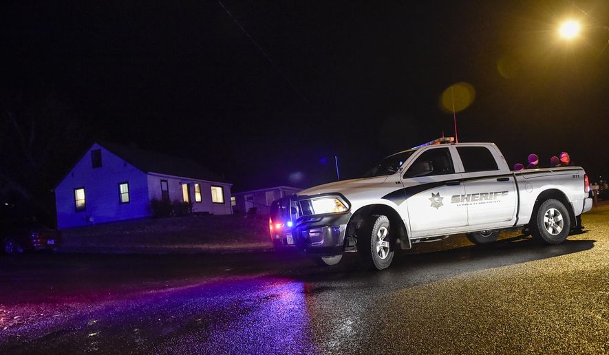 Police respond to the scene Tuesday, Dec. 18, 2018, where a Helena man shot and killed his estranged wife before turning the gun on himself during a birthday party on Helena's Westside, police said Wednesday, Dec. 19, 2018. (Thom Bridge/Independent Record via AP)