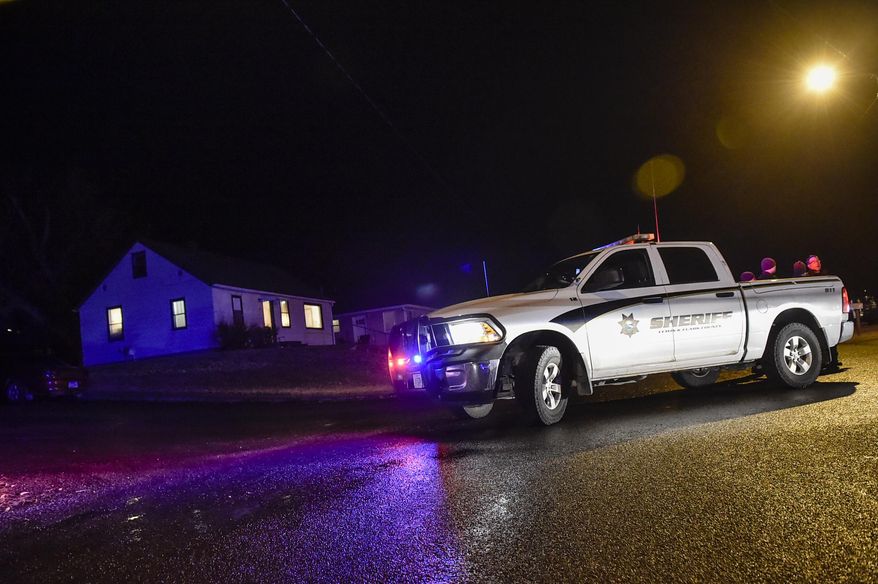 Police respond to the scene Tuesday, Dec. 18, 2018, where a Helena man shot and killed his estranged wife before turning the gun on himself during a birthday party on Helena's Westside, police said Wednesday, Dec. 19, 2018. (Thom Bridge/Independent Record via AP)