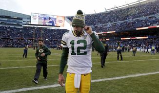 FILE - In this Sunday, Dec. 16, 2018, file photo, Green Bay Packers quarterback Aaron Rodgers walks off the field after a 24-17 loss to the Chicago Bears in an NFL football game in Chicago. Going into this weekend’s game against the New York Jets, Rodgers’ 61.8 percent completion rate was his lowest since his 60.7 rate in 2015, the year that then-top receiver Jordy Nelson was sidelined with a knee injury.  (AP Photo/Nam Y. Huh, File)