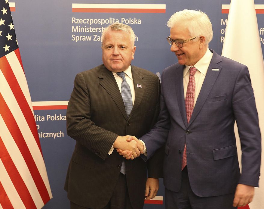 U.S. deputy secretary of state, John Sullivan, right, shakes hands with Polish Foreign Minister Jacek Czaputowicz in Warsaw, Poland, Wednesday, Dec. 19, 2018.The meeting comes as part of a tour by Sullivan to the region. The State Department said ahead of the visit that the reason for his visit to Poland was to reaffirm the U.S. commitment to NATO and commend Poland for its contributions to the alliance's common defense and its efforts to advance energy security.(AP Photo/Czarek Sokolowski)