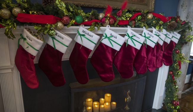 In this file photo, holiday decorations, including stockings, are seen at the Vice President&#x27;s residence, Thursday, Dec. 6, 2018, in Washington, D.C.  (AP Photo/Alex Brandon)  **FILE**