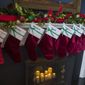 In this file photo, holiday decorations, including stockings, are seen at the Vice President&#39;s residence, Thursday, Dec. 6, 2018, in Washington, D.C.  (AP Photo/Alex Brandon)  **FILE**