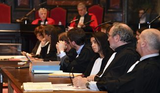 Lawyers and judges wait for the start of a pre-trial hearing in the case of Mehdi Nemmouche, at the Justice Palace in Brussels, Thursday, Dec. 20, 2018. Nemmouche accused of shooting dead four people at a Jewish museum in Belgium in 2014 appeared in court Thursday, as preparations begun for his trial, which is due to start next month. ( AP Photo/Geert Vanden Wijngaert, Pool)