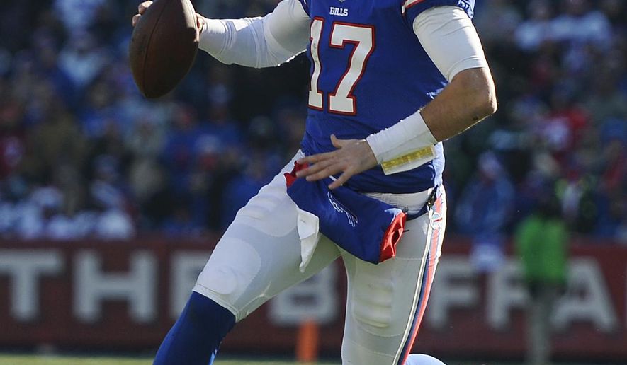 FILE - In this Dec. 9, 2018, file photo, Buffalo Bills quarterback Josh Allen runs against the New York Jets during the first half of an NFL football game, in Orchard Park, N.Y. The Bills play at the New England Patriots on Sunday in Foxborough. The Patriots can lock up a 10th consecutive division title this week with a win or tie against Buffalo. (AP Photo/Adrian Kraus, FileDec. 9, 2018, file photo)