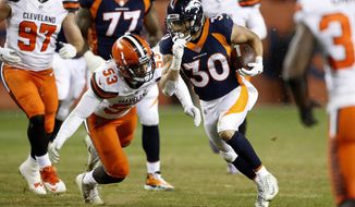 FILE - In this Saturday, Dec. 15, 2018 file photo, Denver Broncos running back Phillip Lindsay (30) runs as Cleveland Browns middle linebacker Joe Schobert (53) pursues during the second half of an NFL football game in Denver. Phillip Lindsay never once thought he&#39;d become the first undrafted offensive player to make the Pro Bowl. He&#39;s been too busy making tacklers miss and general managers regret passing him over in the NFL draft because he stands just 5-foot-8.(AP Photo/Jack Dempsey, File)