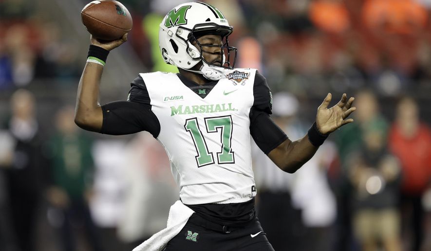 Marshall quarterback Isaiah Green throws a pass during the first half of the Gasparilla Bowl NCAA college football game against South Florida on Thursday, Dec. 20, 2018, in Tampa, Fla. (AP Photo/Chris O'Meara)