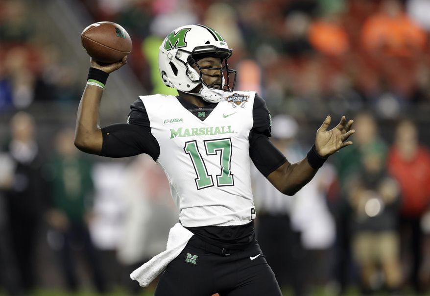 Marshall quarterback Isaiah Green throws a pass during the first half of the Gasparilla Bowl NCAA college football game against South Florida on Thursday, Dec. 20, 2018, in Tampa, Fla. (AP Photo/Chris O'Meara)