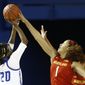 Maryland forward Shakira Austin, right, blocks a shot attempt by Delaware guard Jasmine Dickey in the first half of an NCAA college basketball game, Thursday, Dec. 20, 2018, in Newark, Del. (AP Photo/Patrick Semansky)