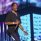 FILE - In this June 2, 2018 file photo, rapper Travis Scott performs at The Governors Ball Music Festival in New York. Scott is in talks to perform at the Super Bowl halftime in Atlanta. A person familiar with the situation, who spoke on the condition of anonymity because they were not allowed to speak about the topic publicly, said that Scott is close to signing on to perform at Super Bowl on Feb. 3 at the Mercedes-Benz Stadium. (Photo by Scott Roth/Invision/AP, FIle)