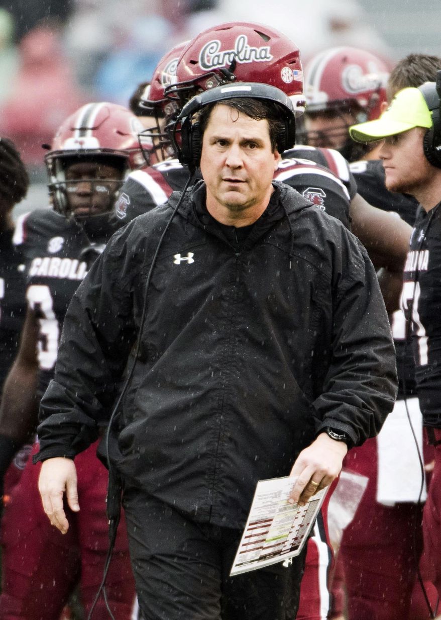 FILE - In this Dec. 1, 2018, file photo, South Carolina head coach Will Muschamp walks across the field during an NCAA college football game against Akron in Columbia, S.C. Muschamp's Gamecocks want to the have a strong finish to their season when they take on Virginia at the Belk Bowl next week. (AP Photo/Sean Rayford, File)