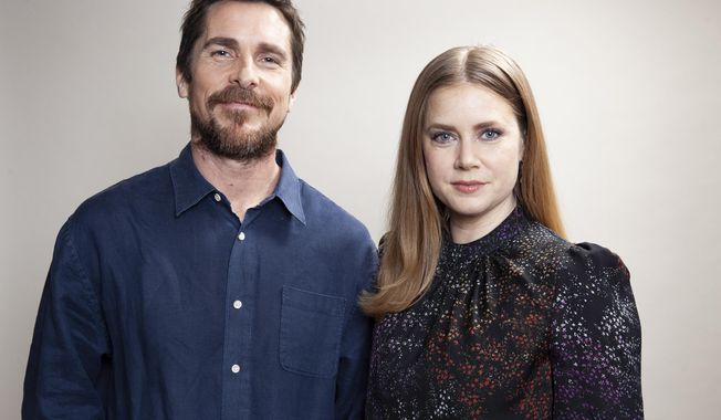 In this Dec. 10, 2018 photo, actors Christian Bale, left and Amy Adams pose for a portrait to promote their film &amp;quot;Vice&amp;quot; at the Viceroy L&#x27;Ermitage Beverly Hills, in Beverly Hills, Calif. (Photo by Rebecca Cabage/Invision/AP)