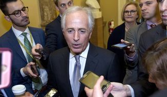 Senate Foreign Relations Committee Chairman Bob Corker, R-Tenn., speaks to reporters as the Senate takes up a House-passed bill that would pay for President Donald Trump&#39;s border wall and avert a partial government shutdown, at the Capitol in Washington, Friday, Dec. 21, 2018. (AP Photo/Jose Luis Magana)