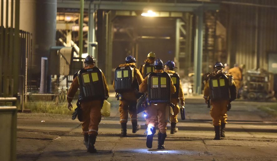 A rescue team is pictured at the CSM coal mime in Karvina, Czech Republic, Tursday, Dec. 20, 2018. The death toll in a methane explosion that hit the coal mine in northeast Czech Republic increased to 13, a mining company said Friday. (Jaroslav Ozana/CTK via AP)