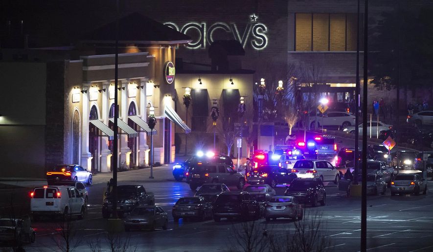 Police and fire departments respond to a report of shots fired at the Christiana Mall Friday, Dec. 21, 2018, in Newark, Del. State Police tweeted that troopers are on the scene at Christiana Mall after they received the reports Friday evening and asked people to avoid the area. (Jason Minto/The News Journal via AP)