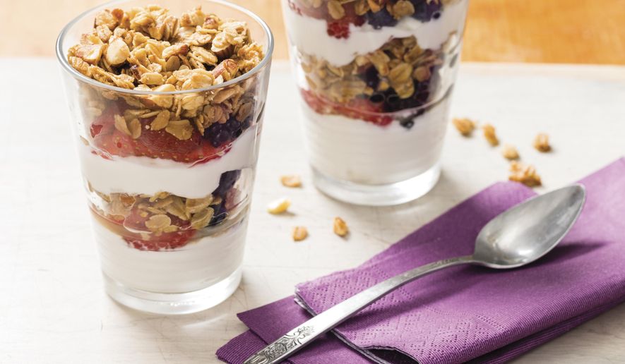This undated photo provided by America's Test Kitchen in December 2018 shows Yogurt and Berry Parfaits in Brookline, Mass. This recipe appears in the "Complete Cookbook for Young Chefs." (Daniel J. van Ackere/America's Test Kitchen via AP)