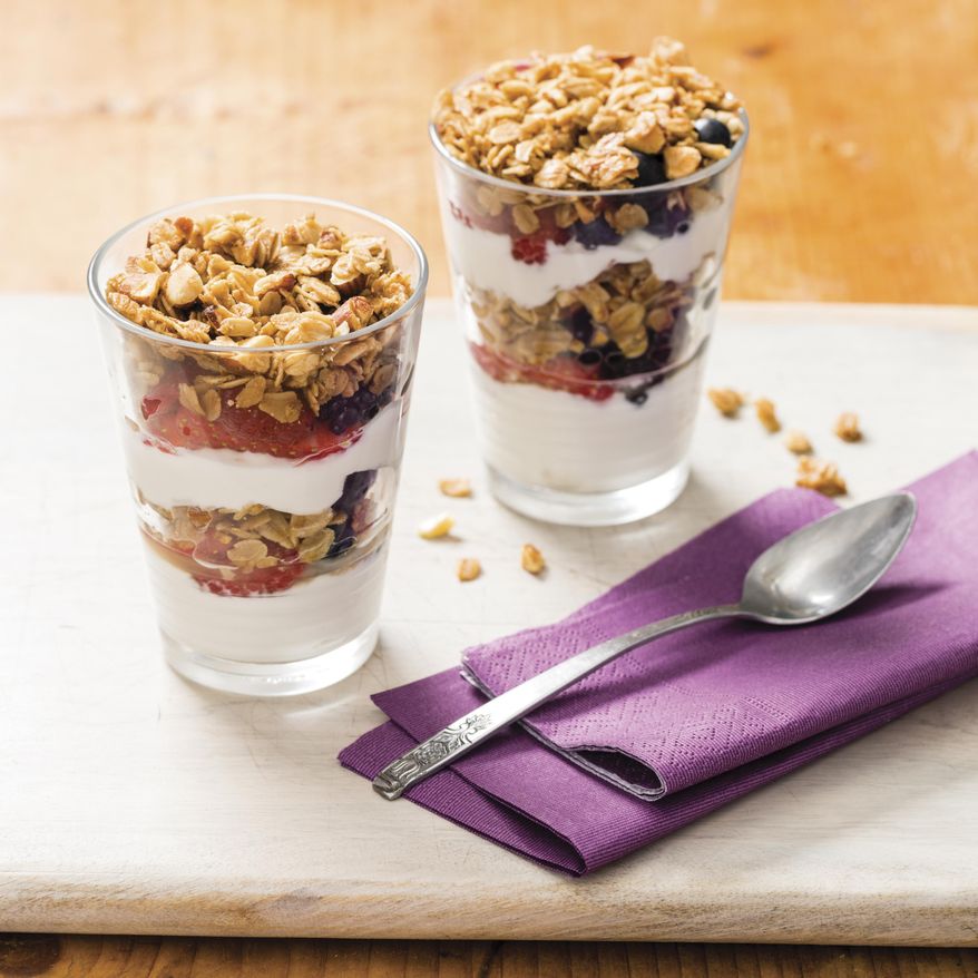 This undated photo provided by America's Test Kitchen in December 2018 shows Yogurt and Berry Parfaits in Brookline, Mass. This recipe appears in the "Complete Cookbook for Young Chefs." (Daniel J. van Ackere/America's Test Kitchen via AP)