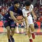Robert Morris forward Charles Bain (20) strips the ball from Louisville forward Jordan Nwora (33) during the second half of an NCAA college basketball game in Louisville, Ky., Friday, Dec. 21, 2018. (AP Photo/Timothy D. Easley)