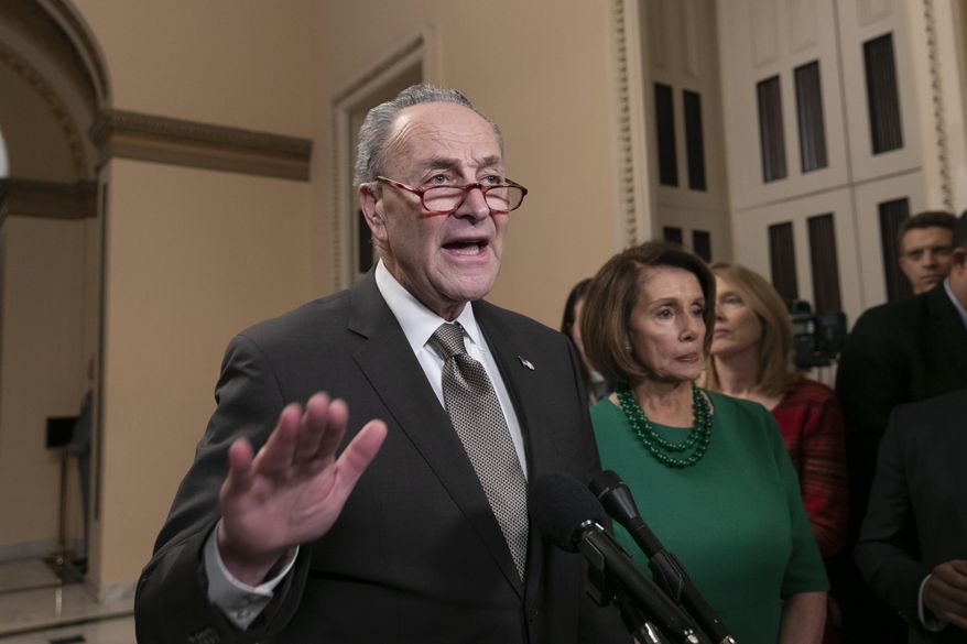 Senate Minority Leader Chuck Schumer, D-N.Y., and House Democratic Leader Nancy Pelosi of California, the speaker-designate for the new Congress, talk to reporters as a revised spending bill is introduced in the House that includes $5 billion demanded by President Donald Trump for a wall along the U.S.-Mexico border, as Congress tries to avert a partial shutdown, in Washington, Thursday, Dec. 20, 2018. (AP Photo/J. Scott Applewhite) **FILE**