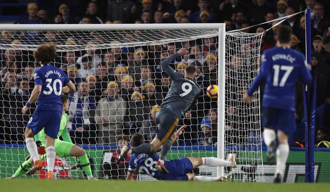 Leicester&#x27;s Jamie Vardy scores his side opening goal during the English Premier League soccer match between Chelsea and Leicester City at Stamford Bridge stadium in London, Saturday, Dec. 22, 2018.(AP Photo/Frank Augstein)