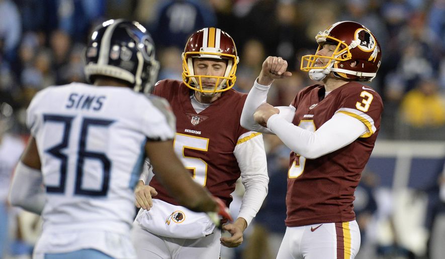 Washington Redskins kicker Dustin Hopkins (3) celebrates after kicking a 40-yard field goal against the Tennessee Titans in the second half of an NFL football game Saturday, Dec. 22, 2018, in Nashville, Tenn. With Hopkins is holder Tress Way (5). (AP Photo/Mark Zaleski) **FILE**