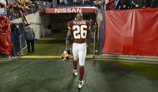 Washington Redskins running back Adrian Peterson leaves the field after an NFL football game against the Tennessee Titans Saturday, Dec. 22, 2018, in Nashville, Tenn. The Titans won 25-16.(AP Photo/Mark Zaleski) ** FILE **