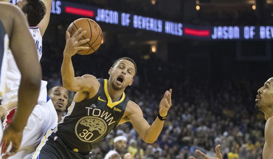 Golden State Warriors guard Stephen Curry (30) gets a rebound against the Los Angeles Clippers in the second quarter of an NBA basketball game, Sunday, Dec. 23, 2018, in Oakland, Calif. (AP Photo/John Hefti)