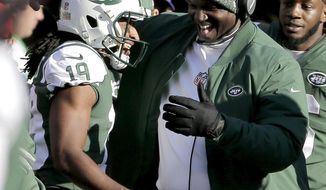 New York Jets&#x27; Andre Roberts, left, is congratulated by head coach Todd Bowles after returning a Green Bay Packers kickoff for a touchdown during the first half of an NFL football game, Sunday, Dec. 23, 2018, in East Rutherford, N.J. (AP Photo/Seth Wenig)