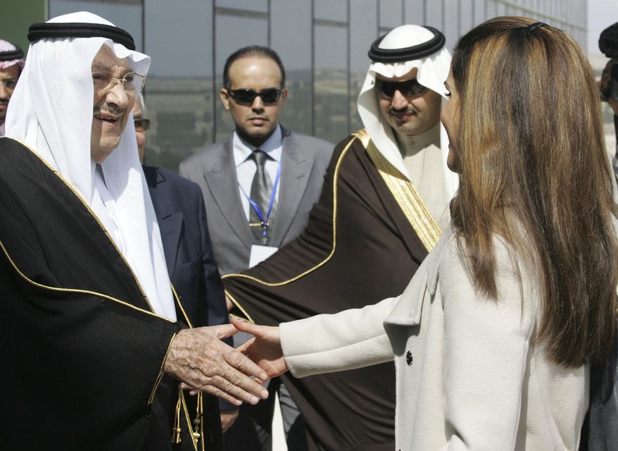 FILE - In this Feb. 24, 2010 file photo, Saudi Prince Talal bin Abdelaziz, left, receives Queen Rania of Jordan during the opening ceremony of the Arab Open University, Jordan branch, in Amman, Jordan. Abdulaziz, a senior member of the royal family who supported women's rights and once led a group of dissident princes, has died at the age of 87. Prince Talal was an older brother to King Salman and the father of businessman Prince Alwaleed bin Talal. The royal court said prayers for Prince Talal, who died on Saturday, will be held in Riyadh on Sunday, Dec. 23, 2018. (AP Photo/Nader Daoud, File)