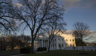 The setting sun illuminates the White House. (AP Photo/Alex Brandon) ** FILE **