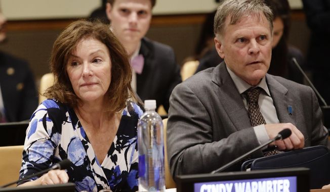 In this May 3, 2018, file photo, Fred Warmbier, right, and Cindy Warmbier, parents of Otto Warmbier, wait for a meeting at the United Nations headquarters. (AP Photo/Frank Franklin II, File)