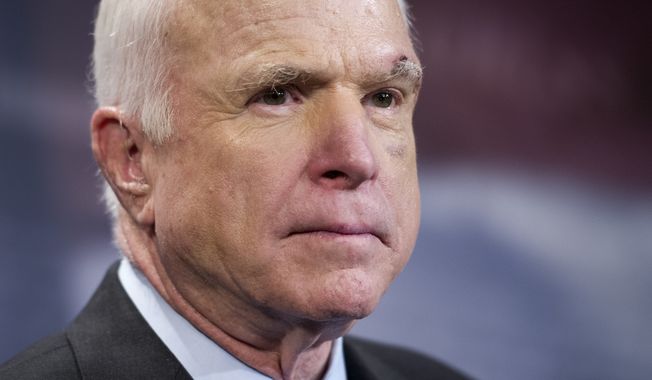Sen. John McCain, who often confounded colleagues in life, continues to do so in death as senators search for an acceptable honor. (Associated Press)