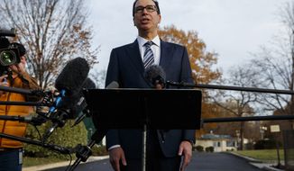 In this Dec. 3, 2018, file photo, Treasury Secretary Steve Mnuchin talks with reporters at the White House in Washington. Trump says he has confidence in Mnuchin, calling him a &quot;very talented guy&quot; and a &quot;very smart person.&quot; (AP Photo/Evan Vucci) **FILE**
